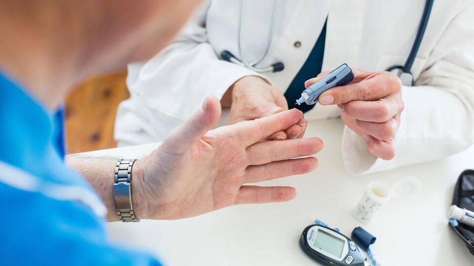 Doctor takes blood for sugar in diabetes